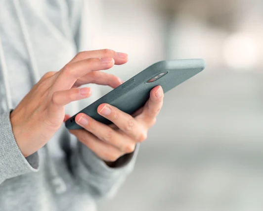 connect Person using a phone to book a counselling appointment online